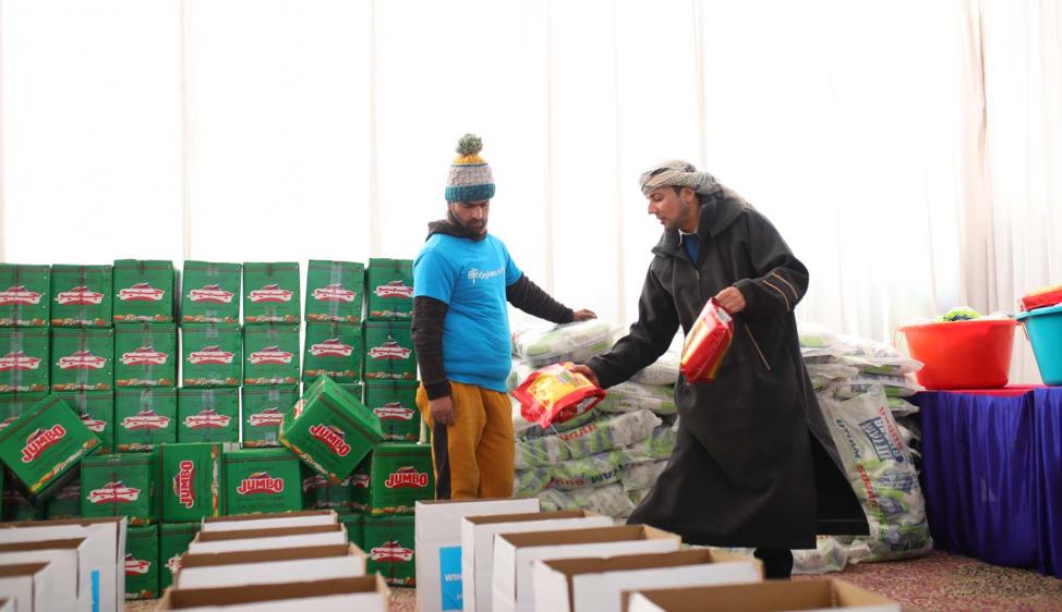 Sheikh Anis Musa, Founder of Orphans in Need, getting hands on with the packing of your food parcels.